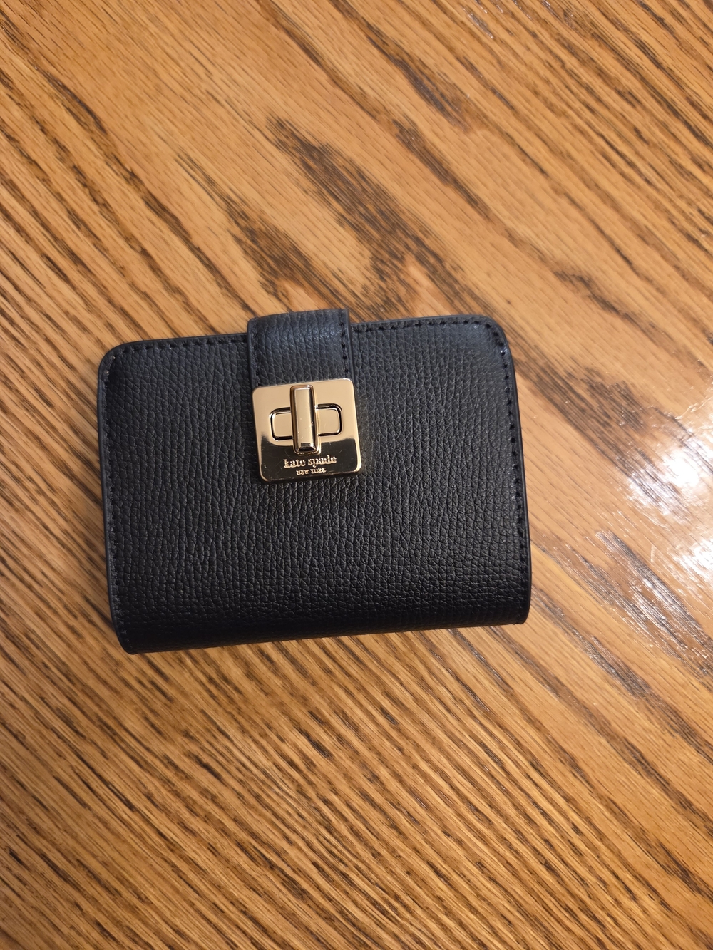 kate spade Black Pebbled Leather Turnlock Wallet with Gold Accent